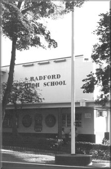The school front entrance near the flag pole